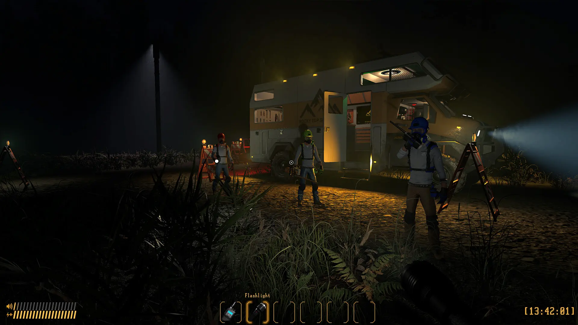 Three players in hard hats and gas masks stand by a lit van at night in the horror game Black Pine.