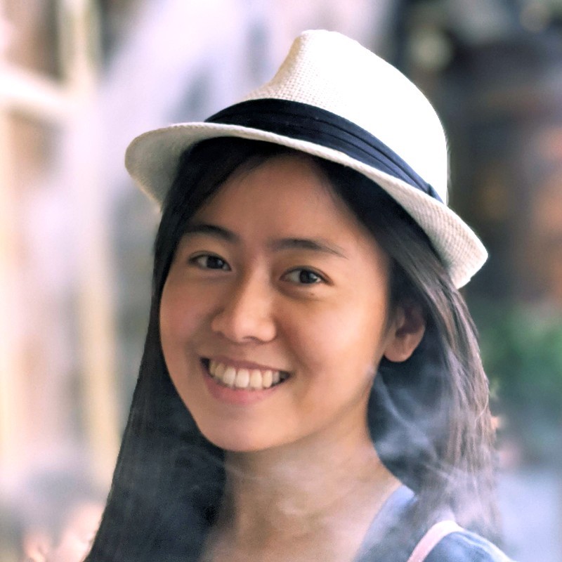 Jing Li wearing a white hat